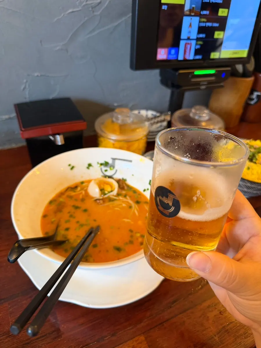 A glass of Sapporo draft beer, 200ml