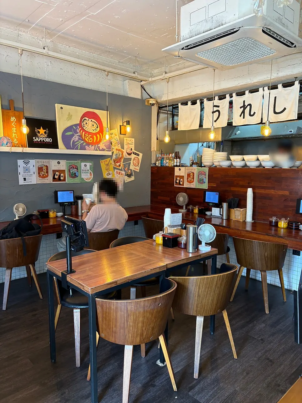 Bar seating with a Japanese ramen shop atmosphere