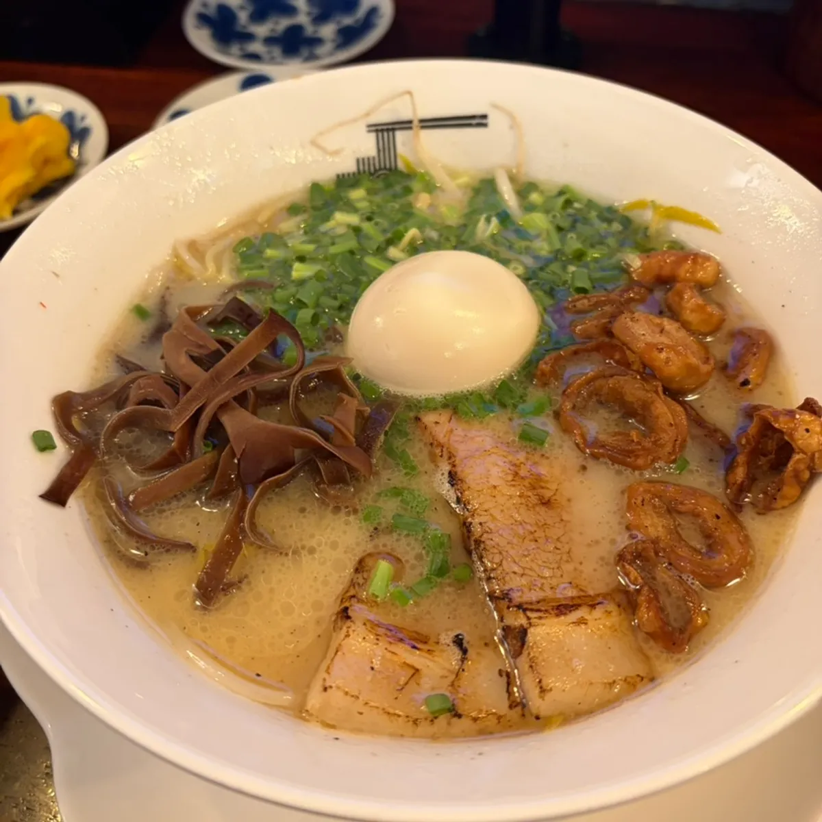 Two bowls of served Gyedan Ramen and Motsu Ramen