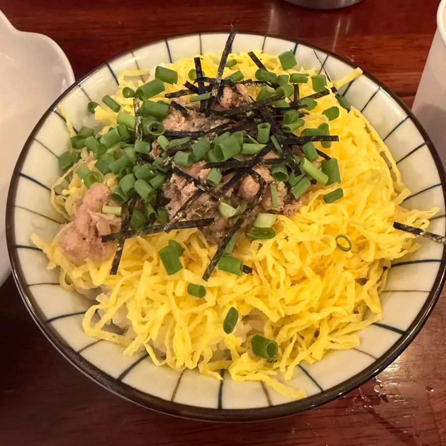 Close-up of char siu, soft-boiled egg, and wood ear mushroom toppings