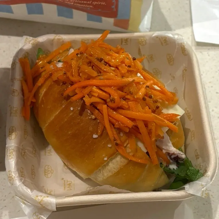 Cross-section of the carrot râpée chicken sandwich