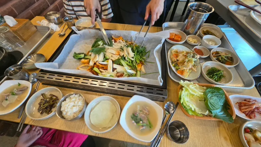 Full table spread of duck bulgogi at Seokgi Sidae