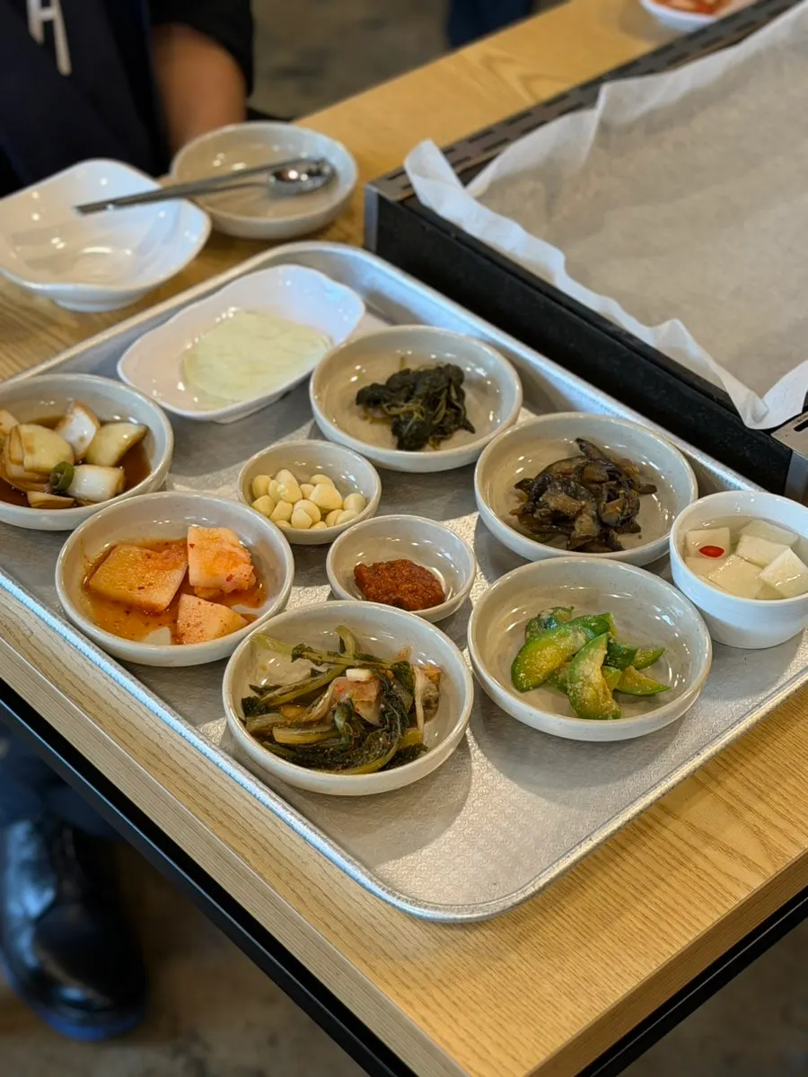 Duck bulgogi side dishes served on a tray