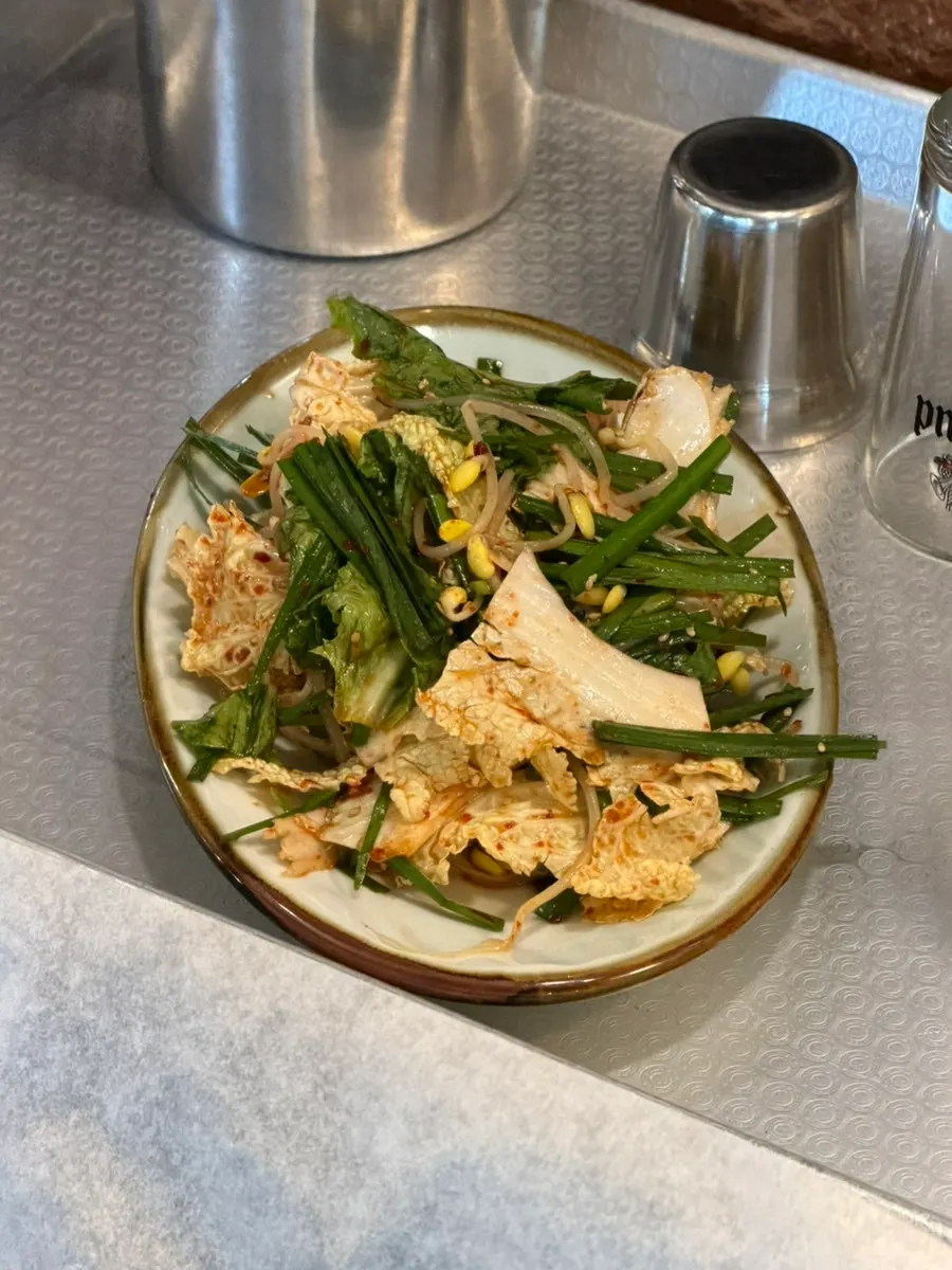 Seasoned cabbage, garlic chive, and bean sprout side dish
