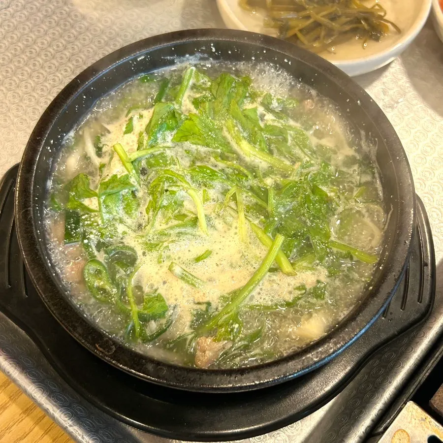 Complimentary duck soup served with an order of spicy stir-fried duck