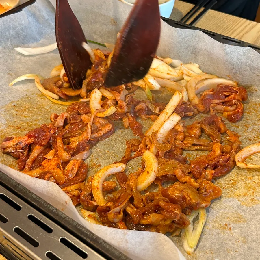 Spicy stir-fried duck served alongside duck soup