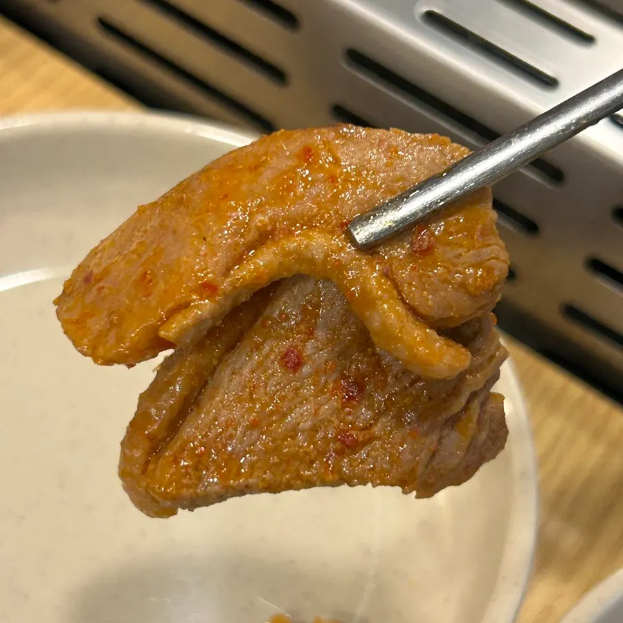Spicy stir-fried duck served in a pickled radish wrap