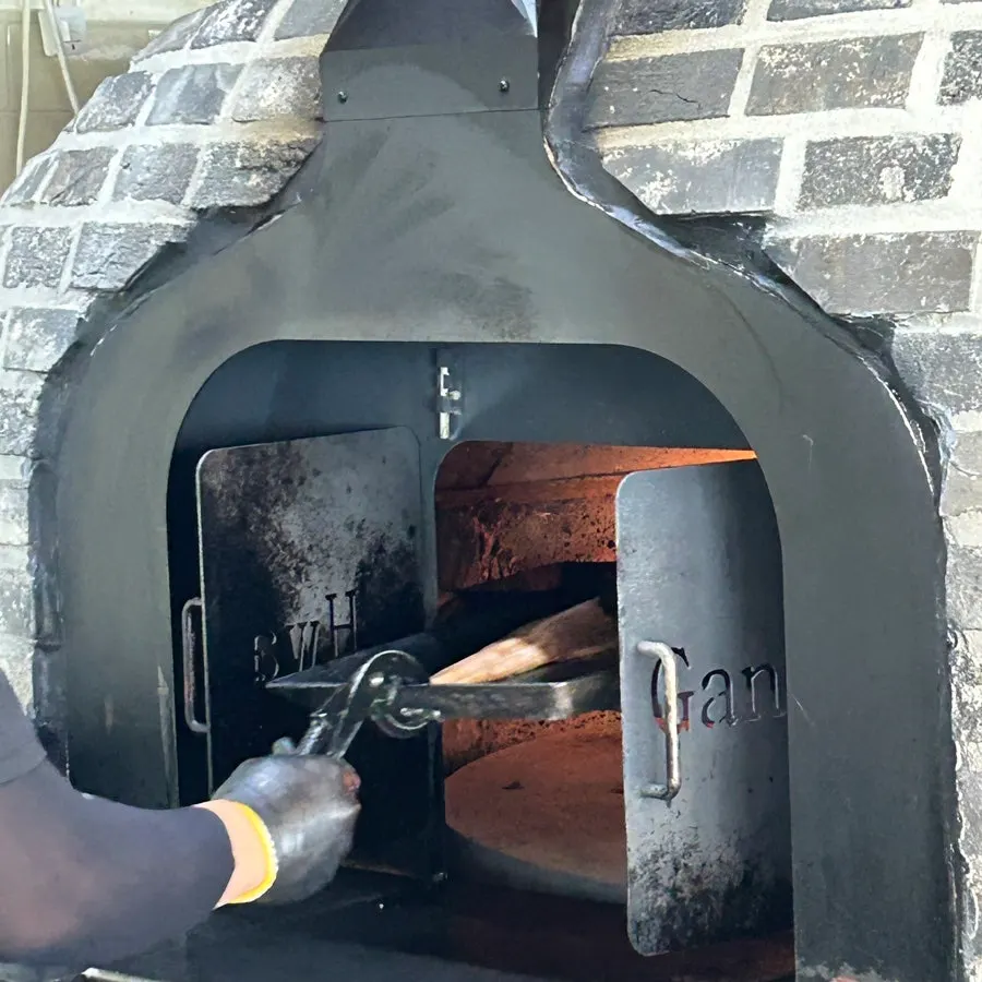 Grilled fish cooked in a 500°C wood-fired oven