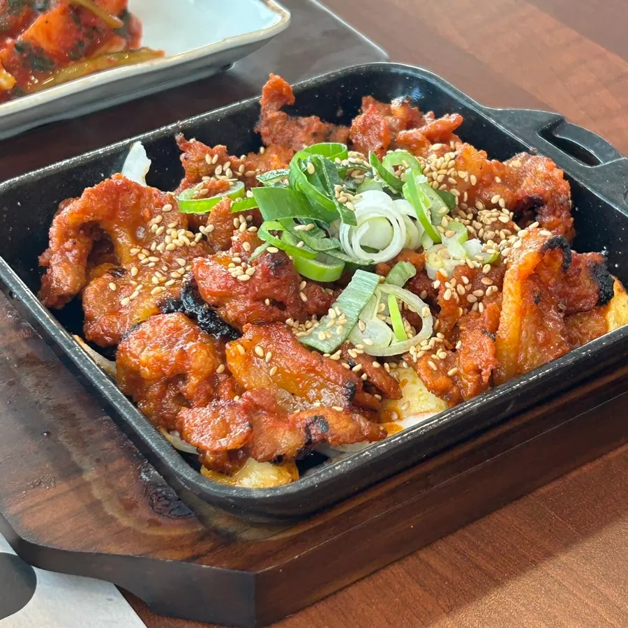 Spicy pan-fried pork stir-fry cooked in the wood-fired oven