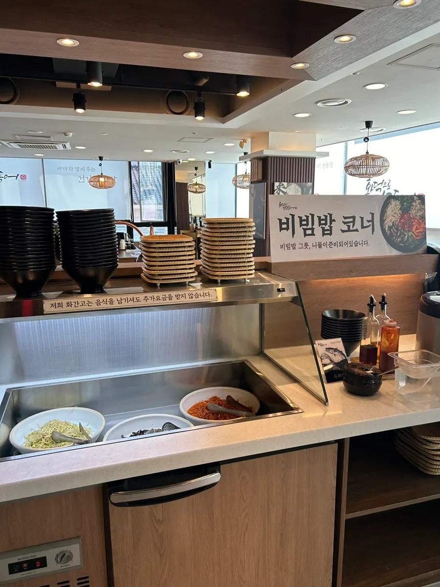 Self-serve corner with bibimbap ingredients ready