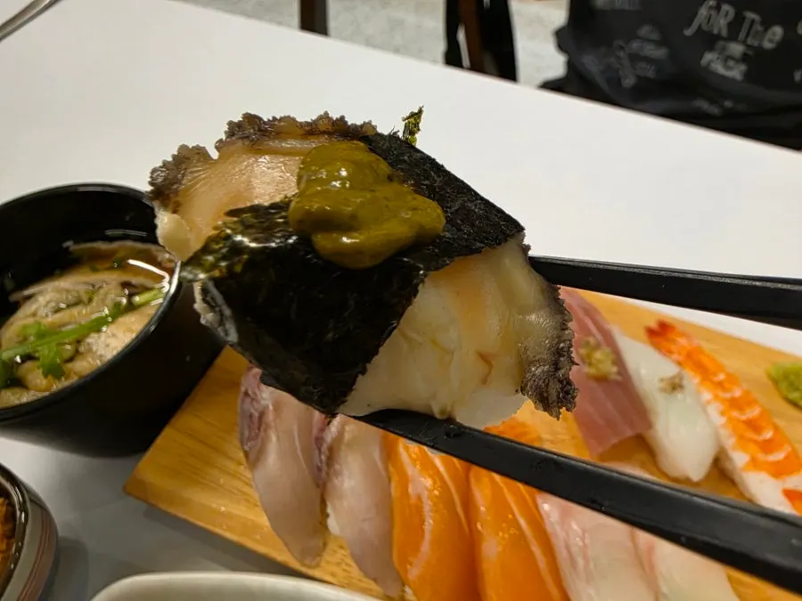 Close-up of a large piece of aged neta sushi