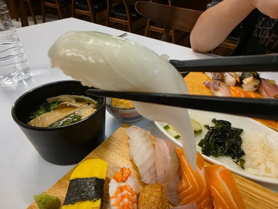 A piece of aged white fish sushi