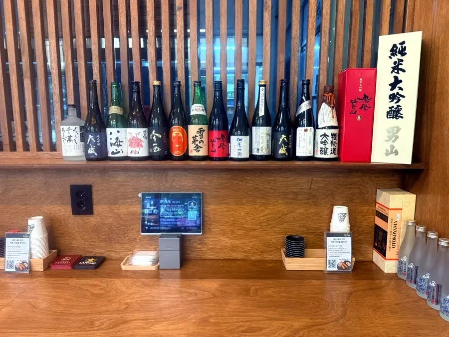 Interior of Hwangje Sushi with 4-person tables