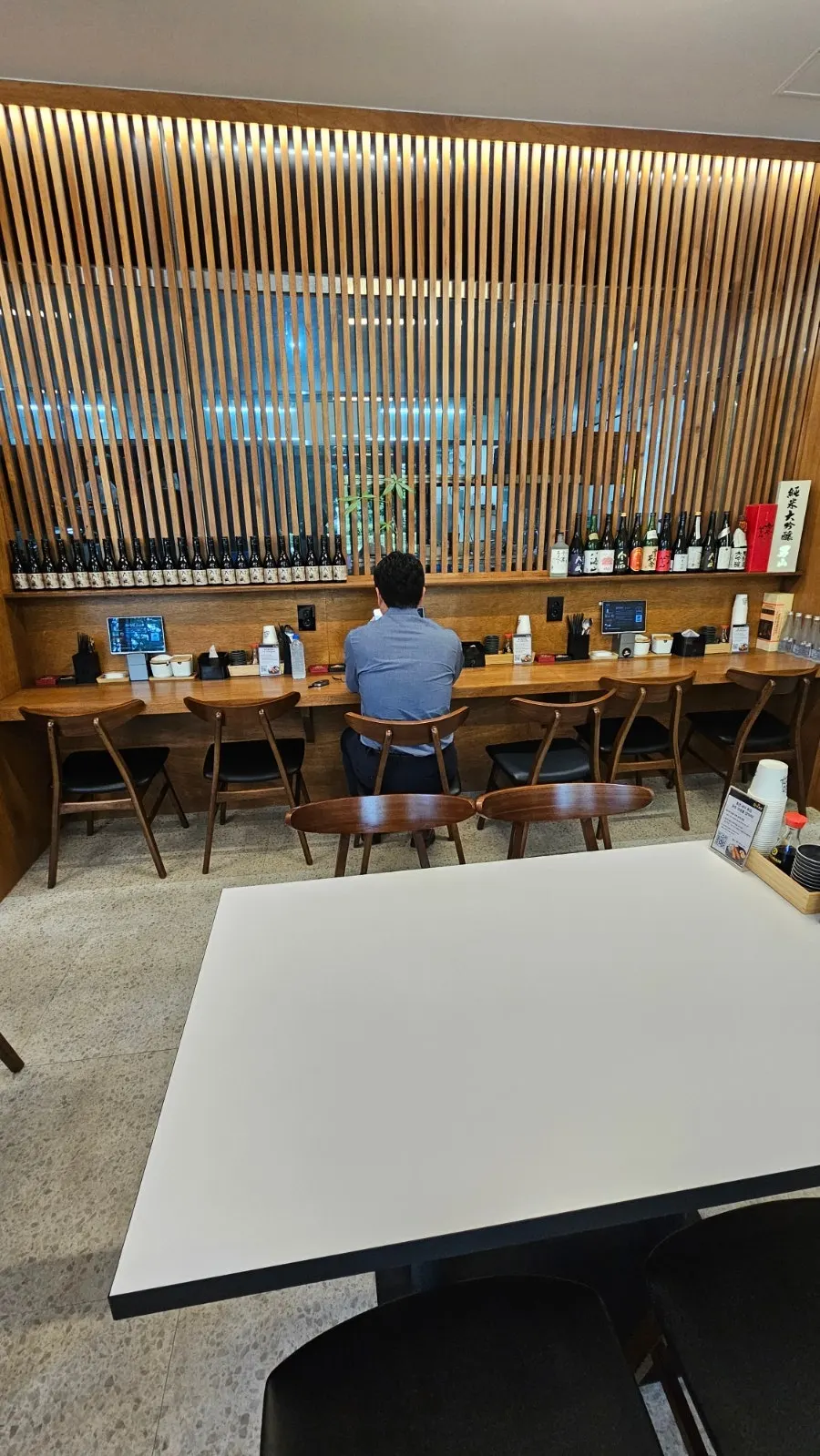 Seating with 2-person and 4-person tables inside the restaurant