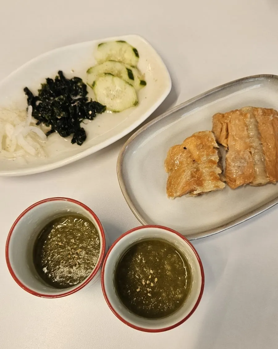 Table set for two with basic side dishes laid out