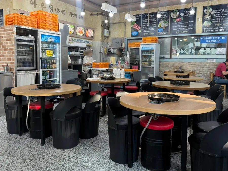 Storefront with signage indicating 24-hour operation