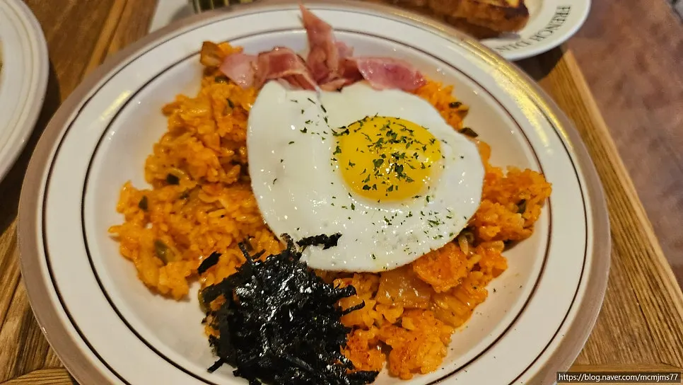 Table with French toast plate and pilaf
