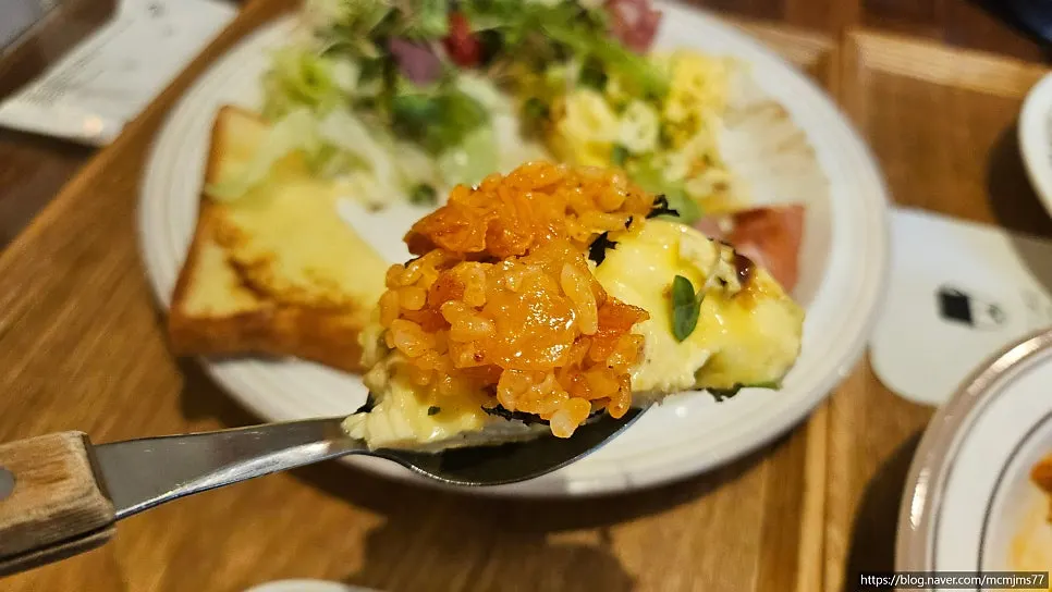 Spoonful of kimchi pilaf lifted up