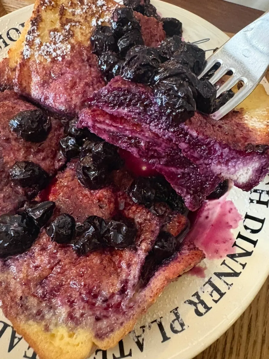 Plate of French toast topped with blueberries