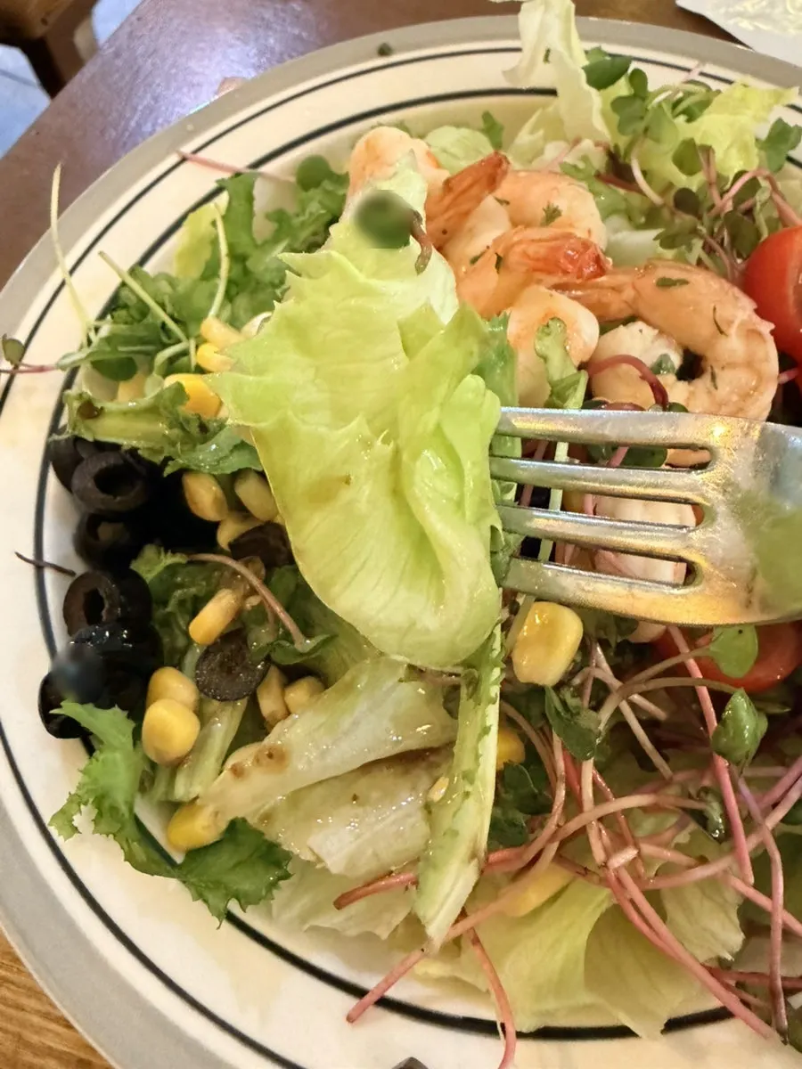 A bowl of salad filled with fresh vegetables