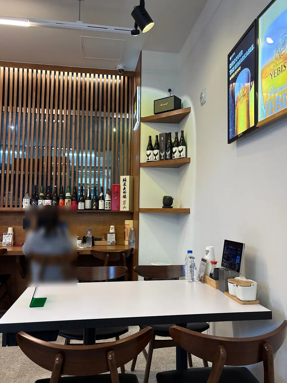 Sushi restaurant interior in white and wood tones