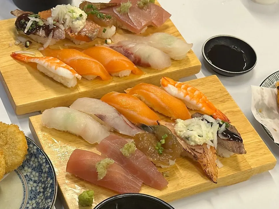 Glossy plate of assorted sushi