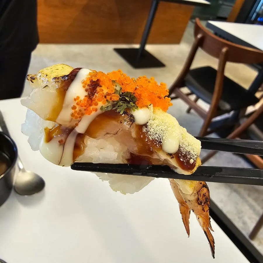 Close-up of grilled shrimp and soy-marinated shrimp sushi