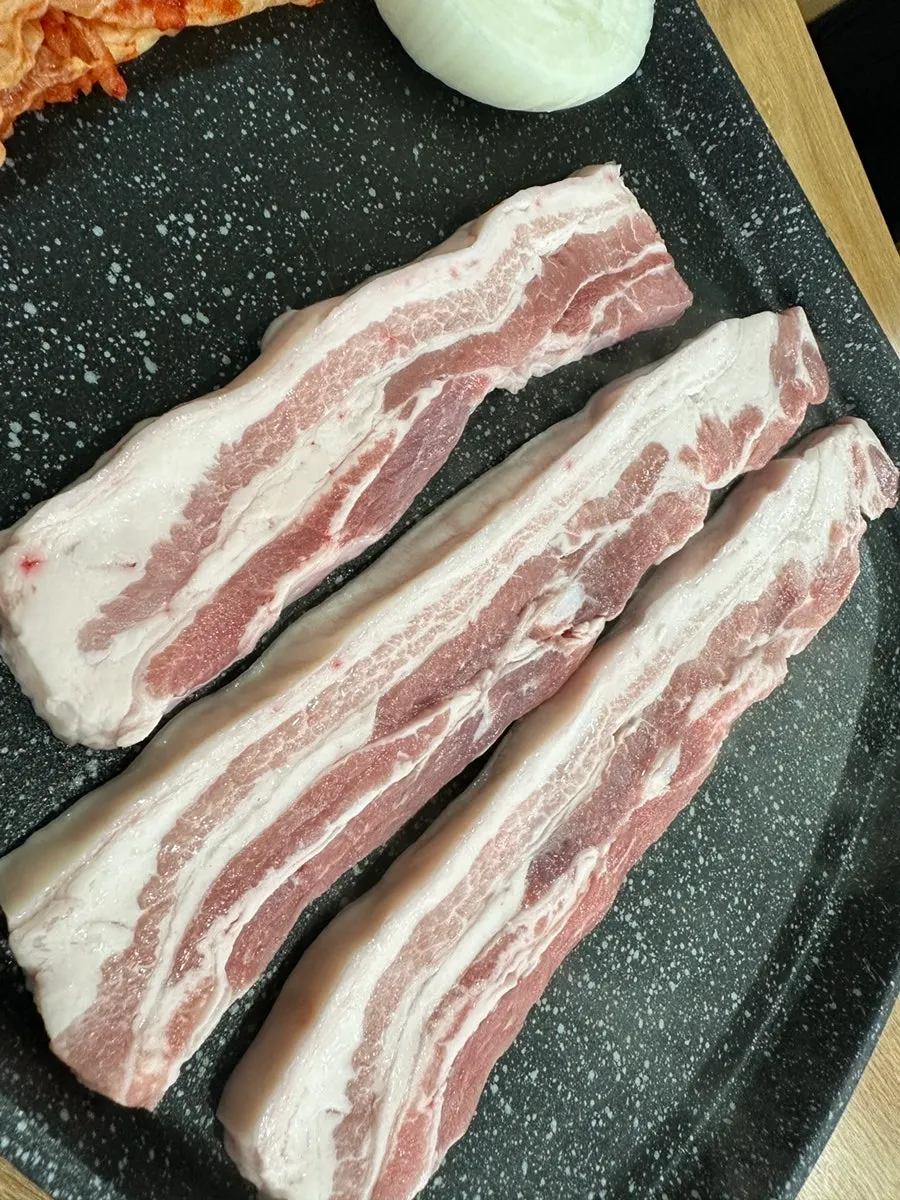 Thickly sliced raw ogyeopsal, one serving