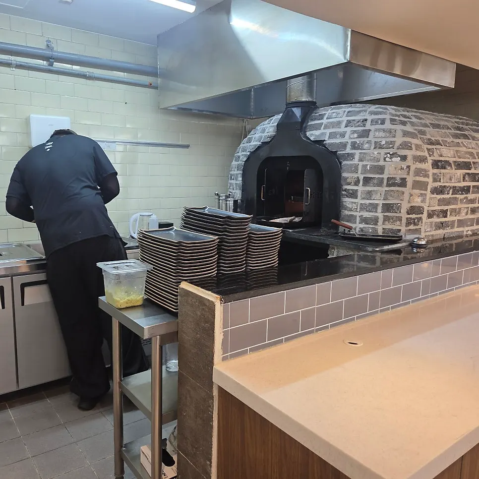 The 500-degree wood-fired oven used to grill fish