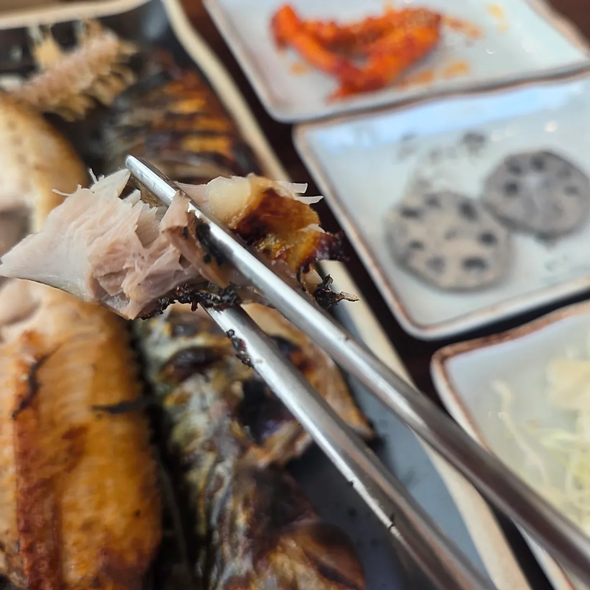 Close-up of the moist flesh of the wood-fired grilled fish