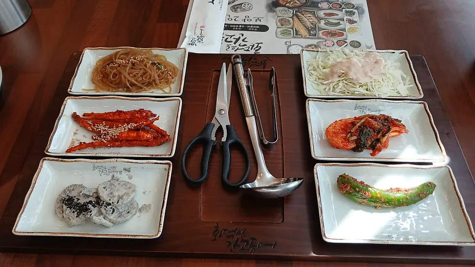 A full spread of banchan on the table