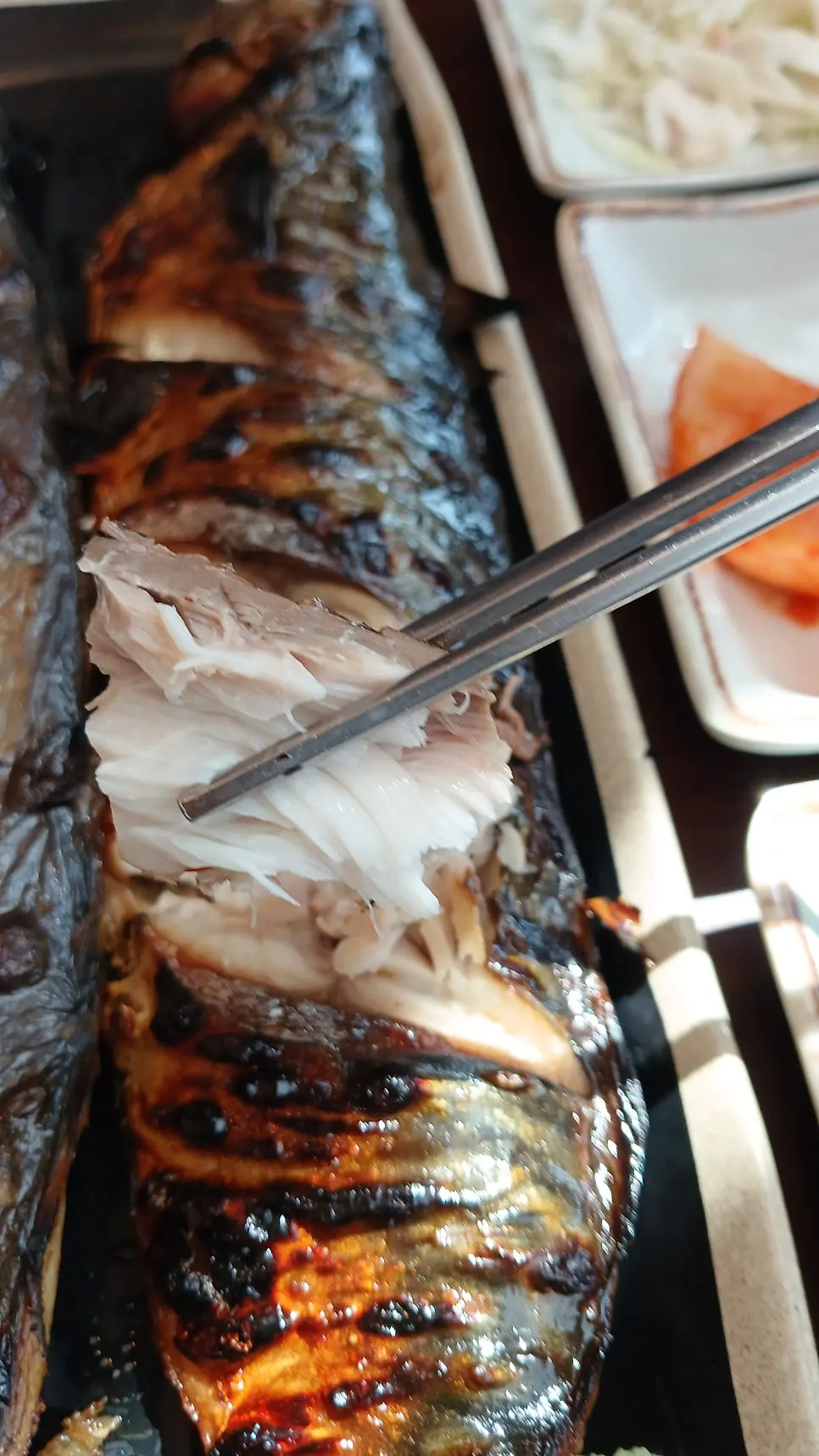 Close-up of the wood-fired grilled mackerel