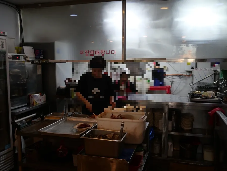 Staff preparing soy crab in the restaurant
