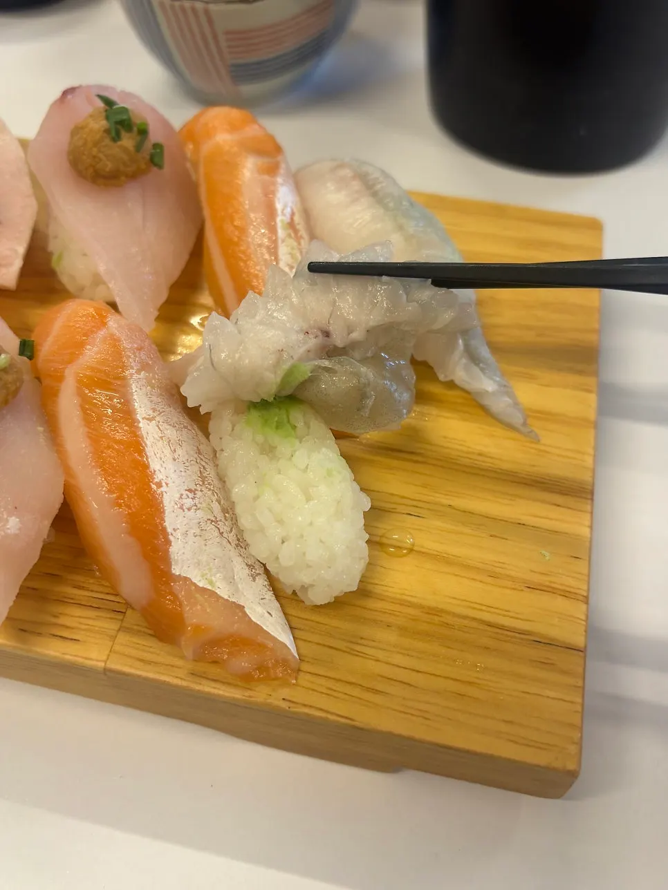 Picking up a piece of sushi