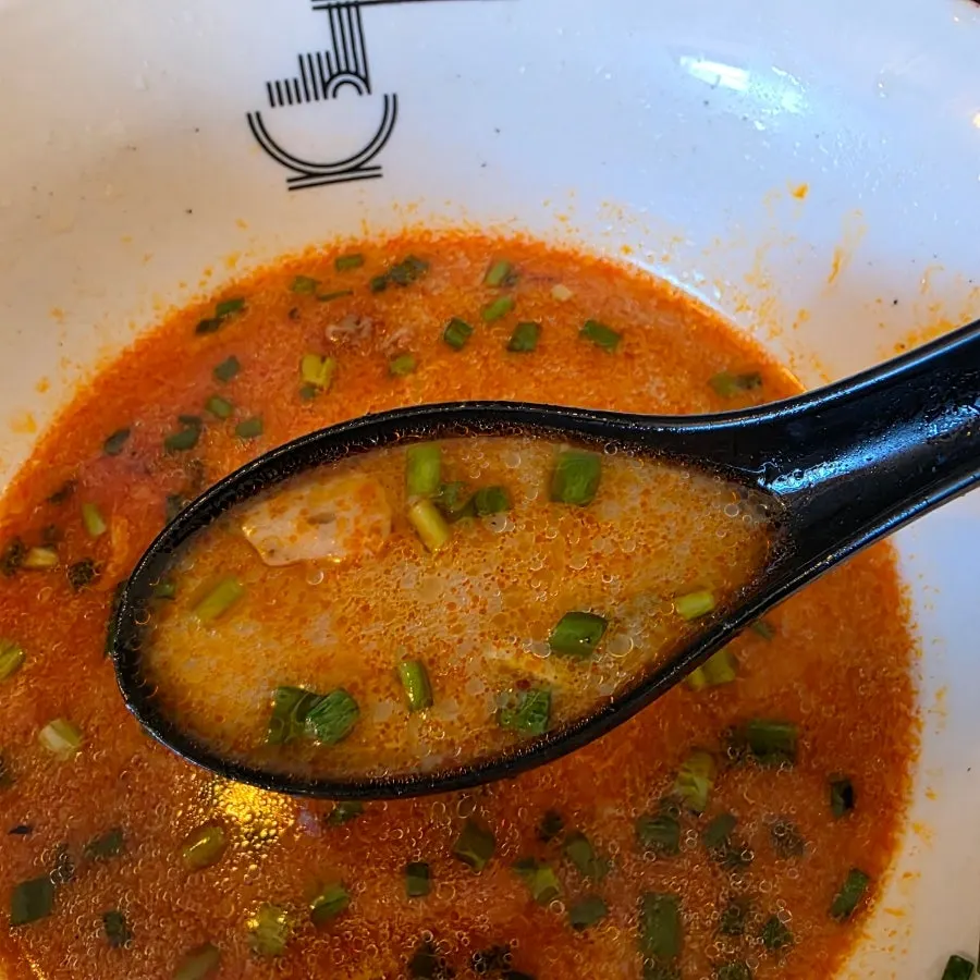 Ramen broth with spicy sauce added