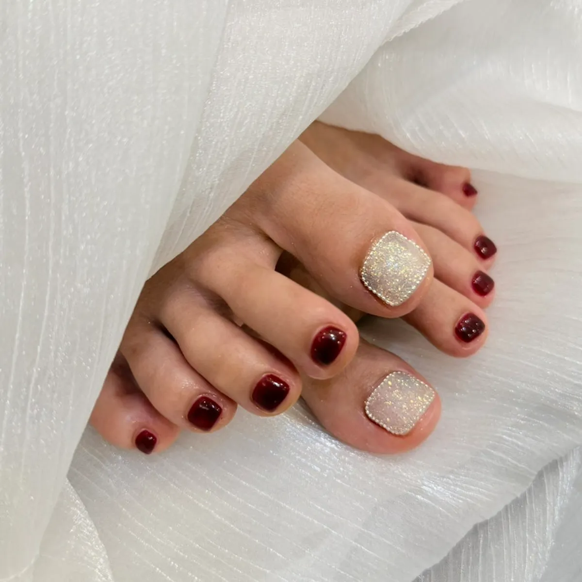 Finished pedicure with glitter accent