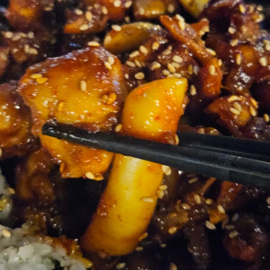 Glossy seasoned chicken topped with sesame seeds