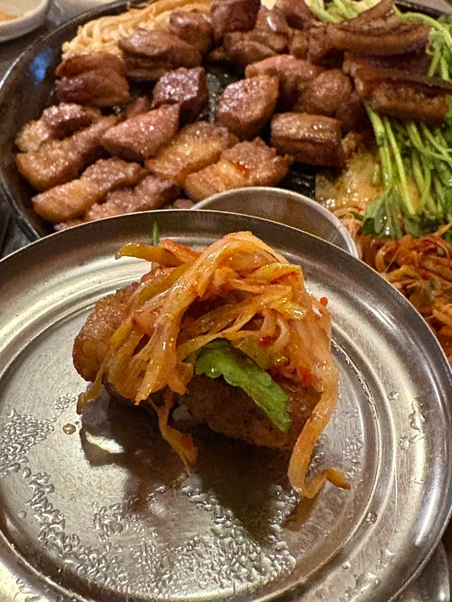 Close-up of chewy grilled pork skin