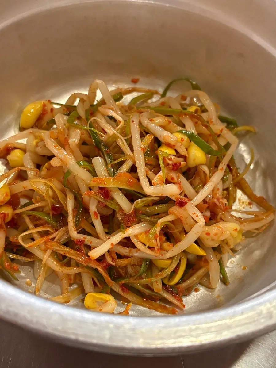 Refilled plate of bean sprout scallion salad