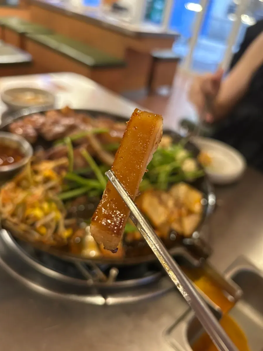 A piece of meat dipped in meljeot sauce