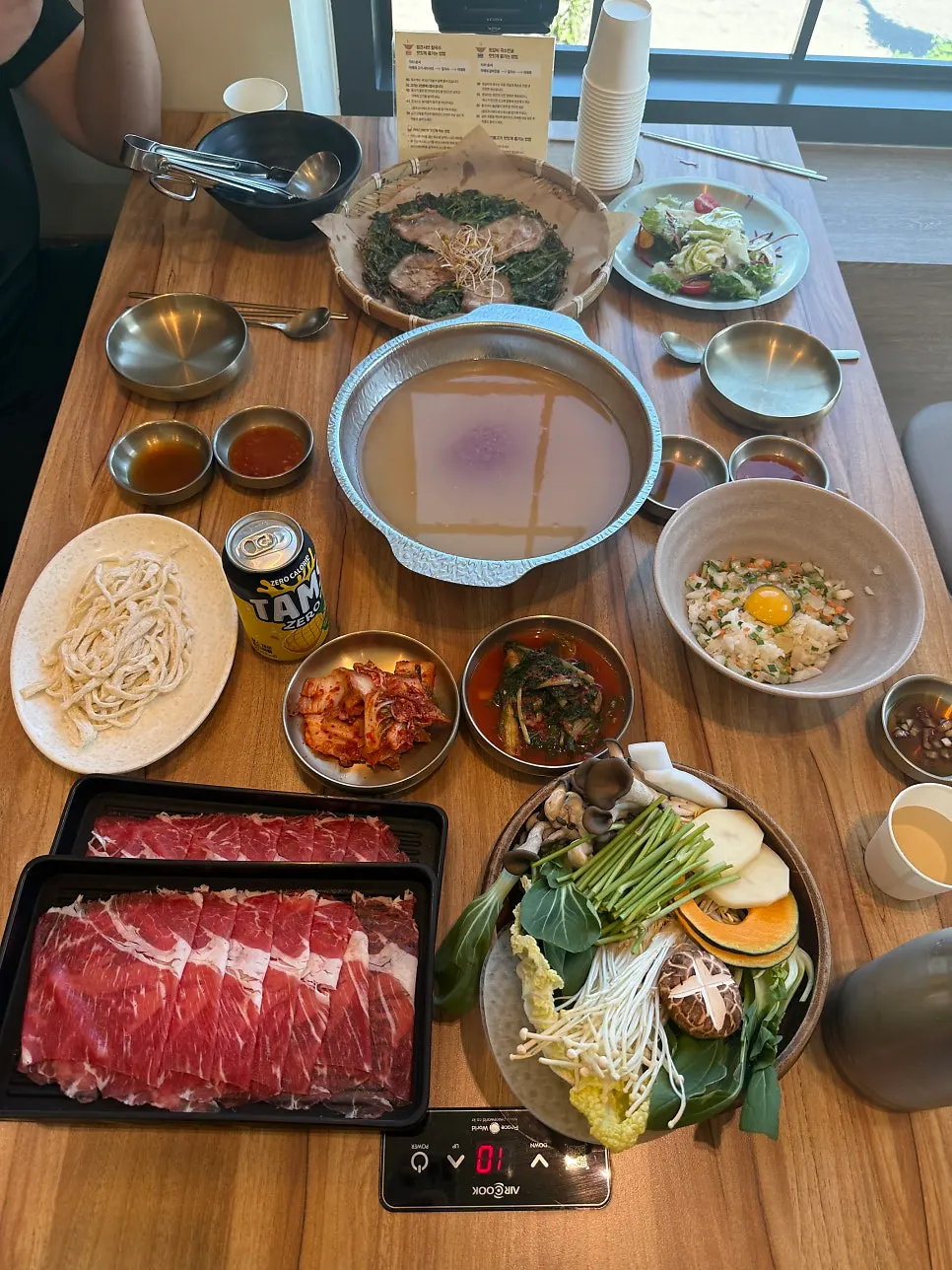 The full spread of shabu-shabu and minari pancake shared between two