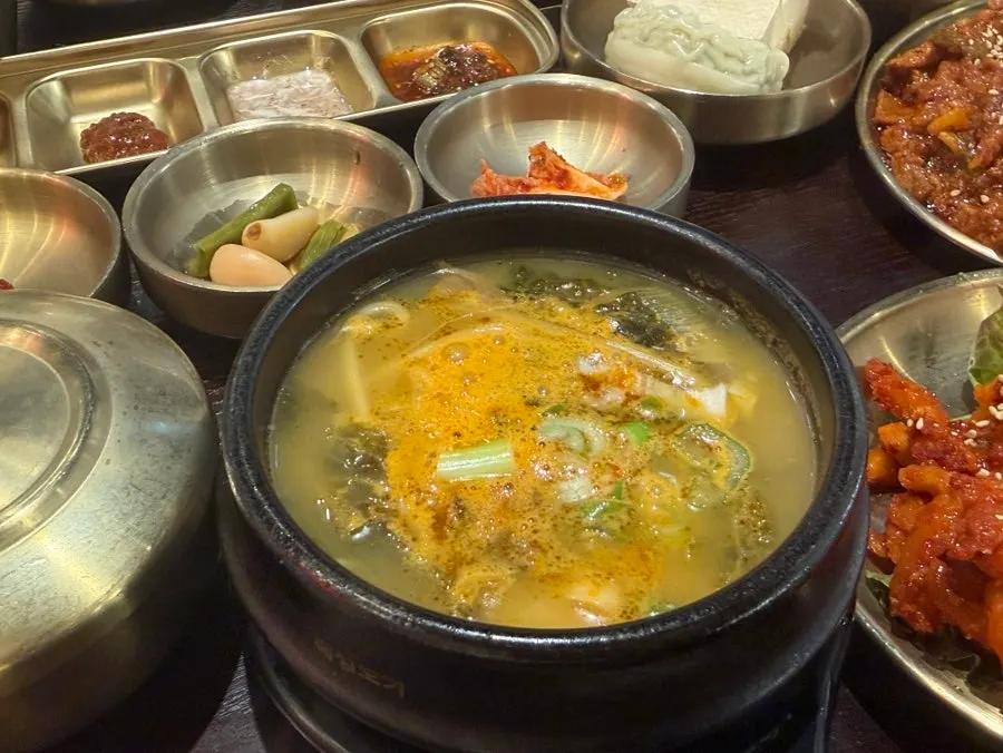 Bossam jeongsik and pork stir-fry served together on the table