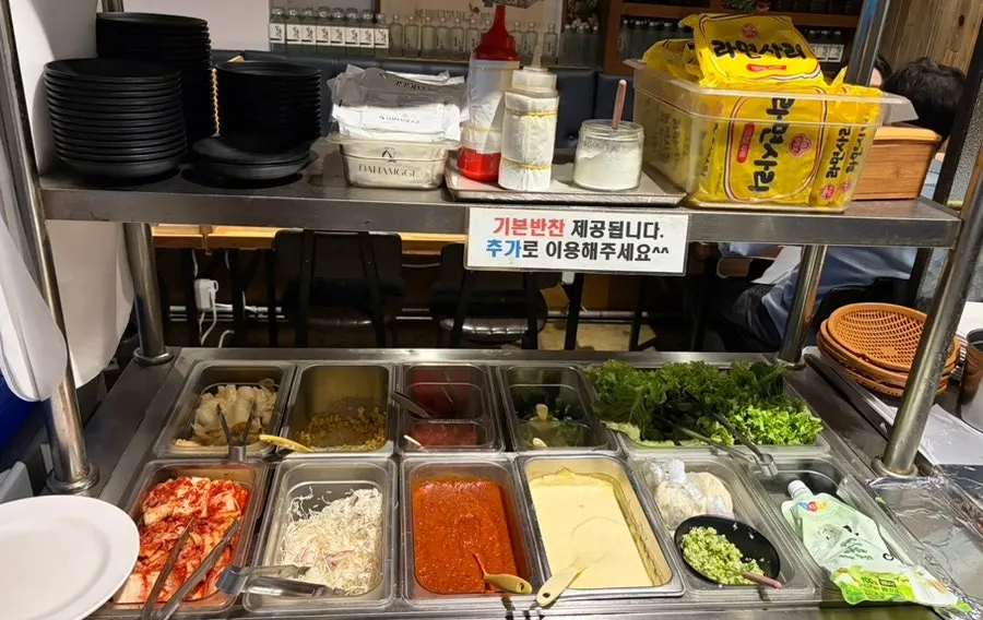 Self-serve bar stocked with basic side dishes