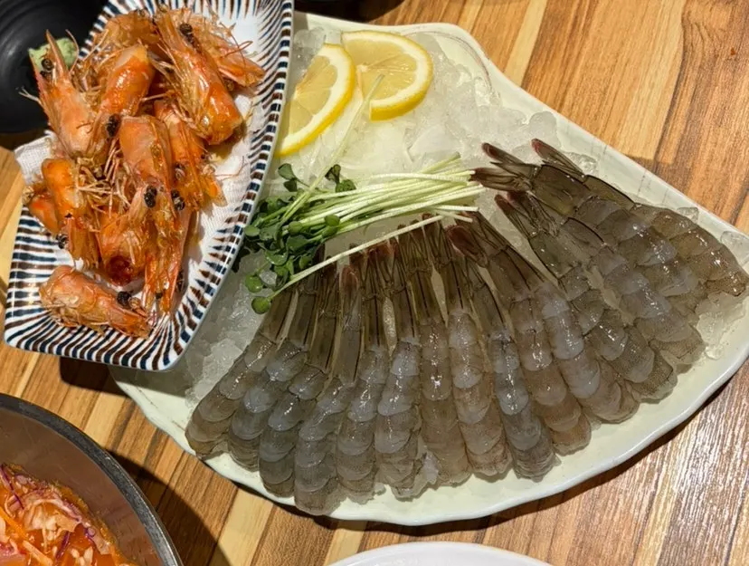 A plate of plump, springy raw shrimp sashimi
