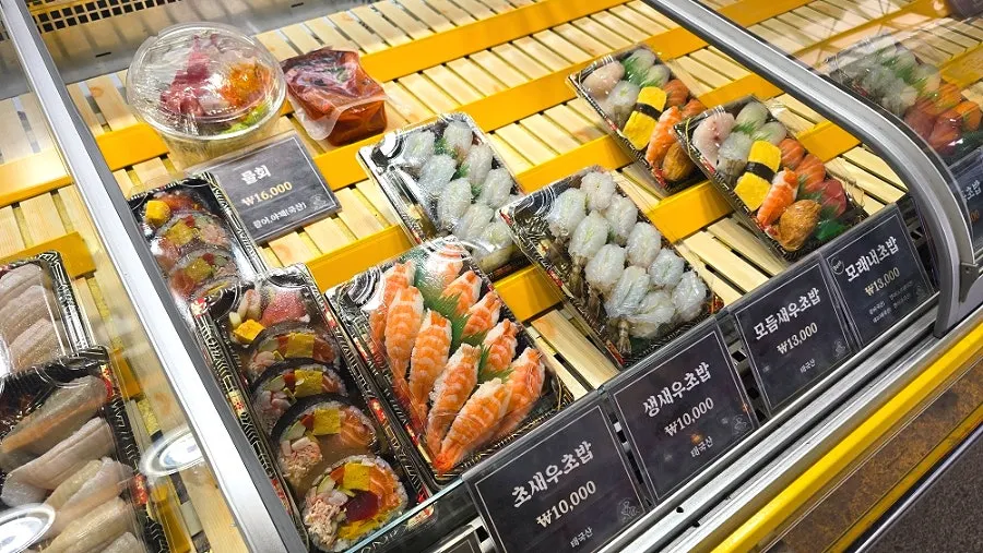 Display of sashimi sushi and shrimp sushi