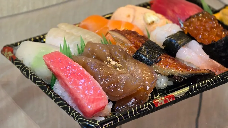 11-piece omakase sushi with tuna, eel and sea urchin gunkan
