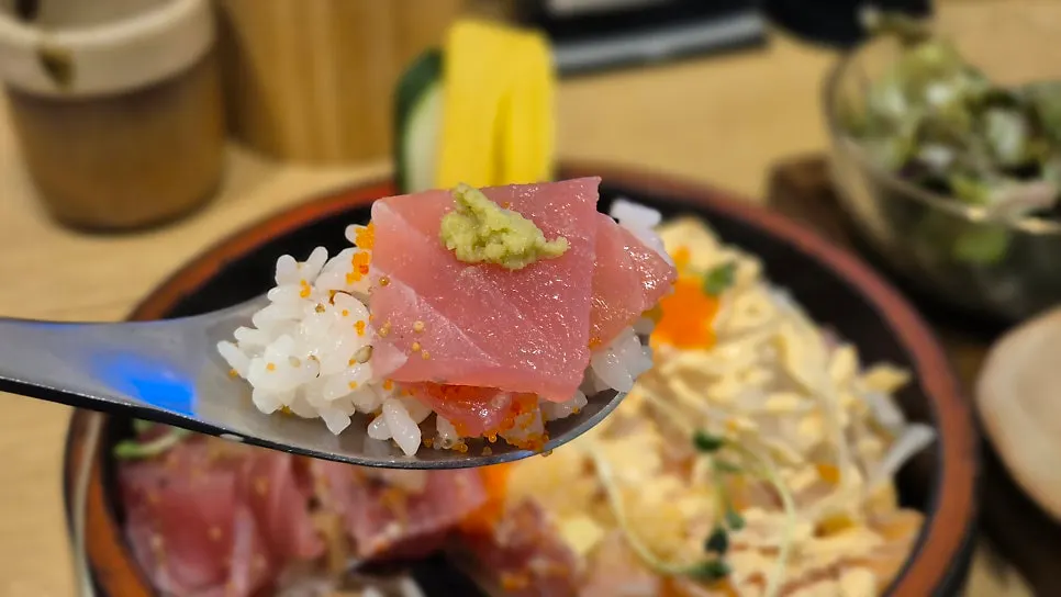 Lotus root, mushroom, and cucumber layered under the rice