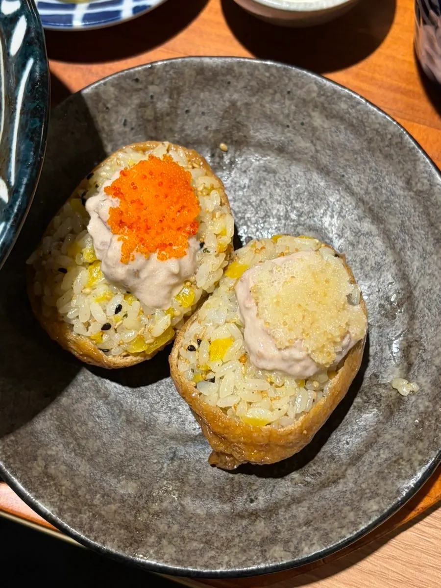 2 pieces of tuna fried tofu sushi topped with tuna and flying fish roe