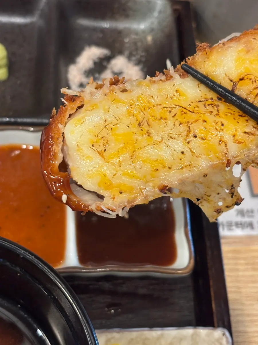Flame-charred surface of the cheese katsu