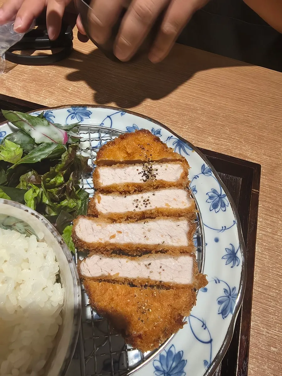Salmon lifted up from within the spoonable sushi